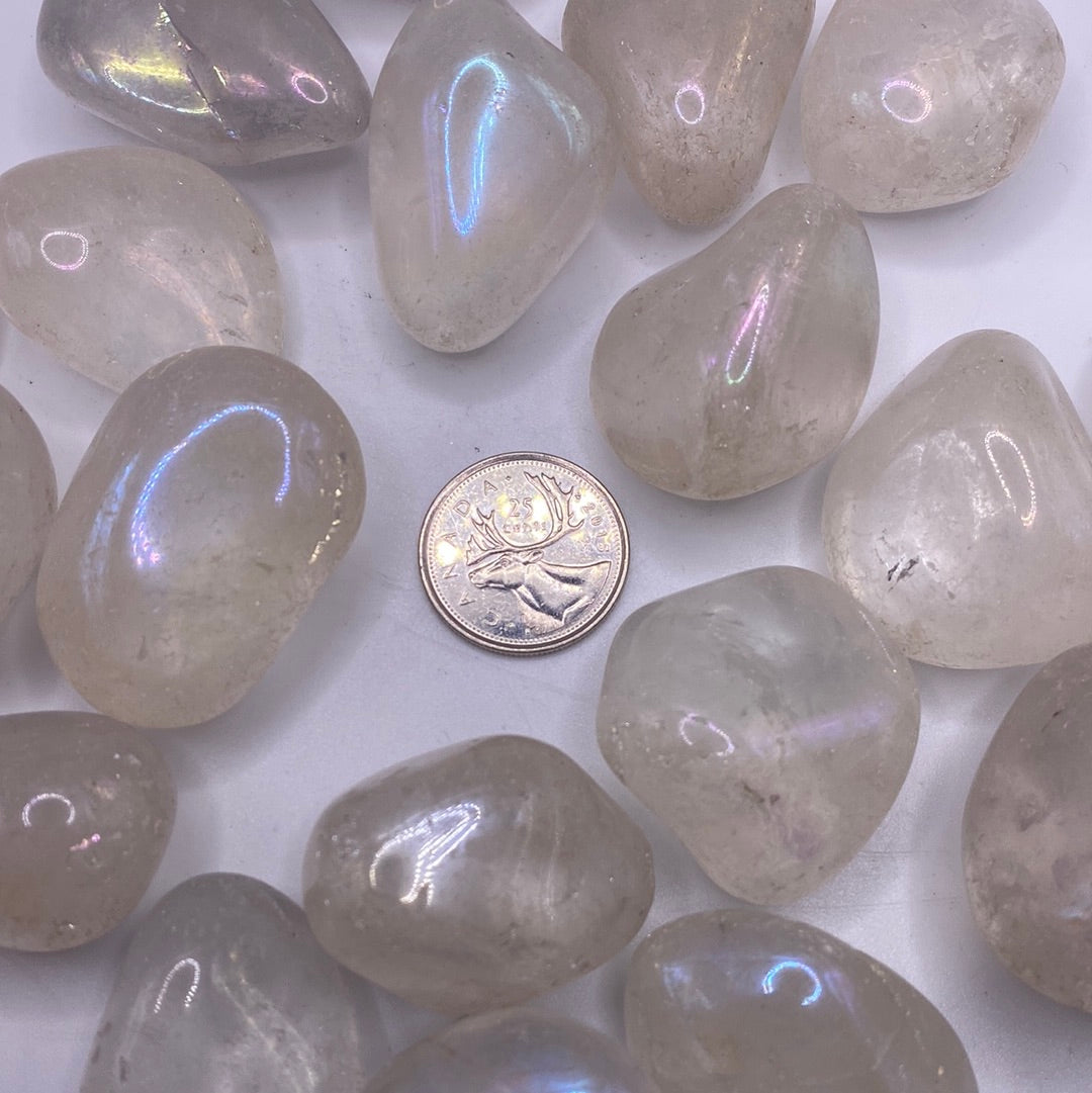 Aura Quartz Tumbled Stone (L) showcasing its iridescent colors and smooth surface, radiating positive energy.