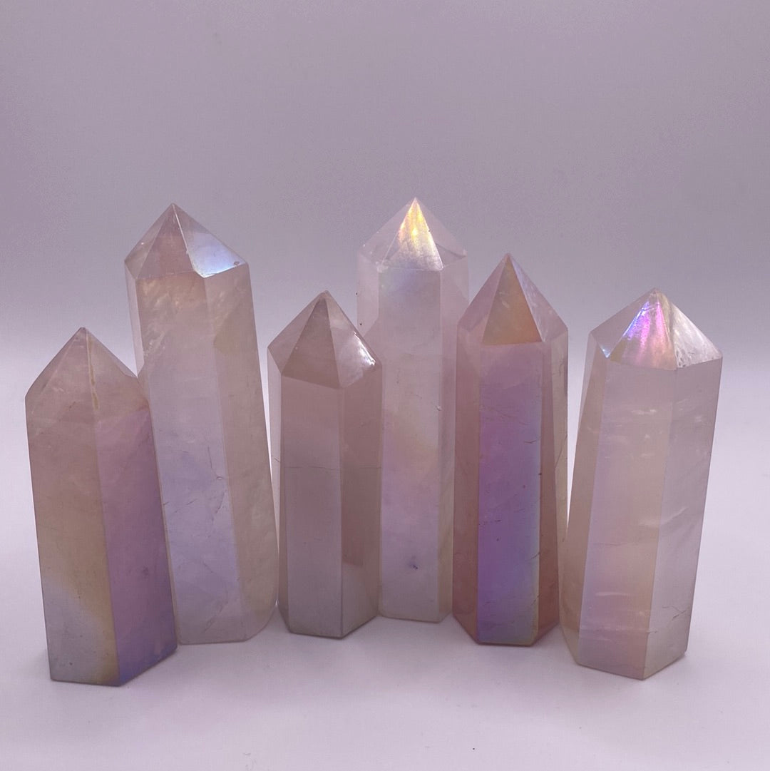 Aura Rose Quartz Polished Points showcasing their beautiful pink color and smooth surfaces, ideal for healing and decoration.