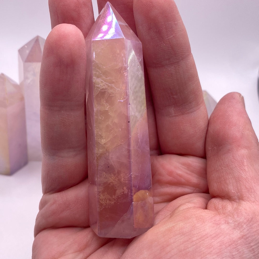 Aura Rose Quartz Polished Points showcasing their beautiful pink color and smooth surfaces, ideal for healing and decoration.