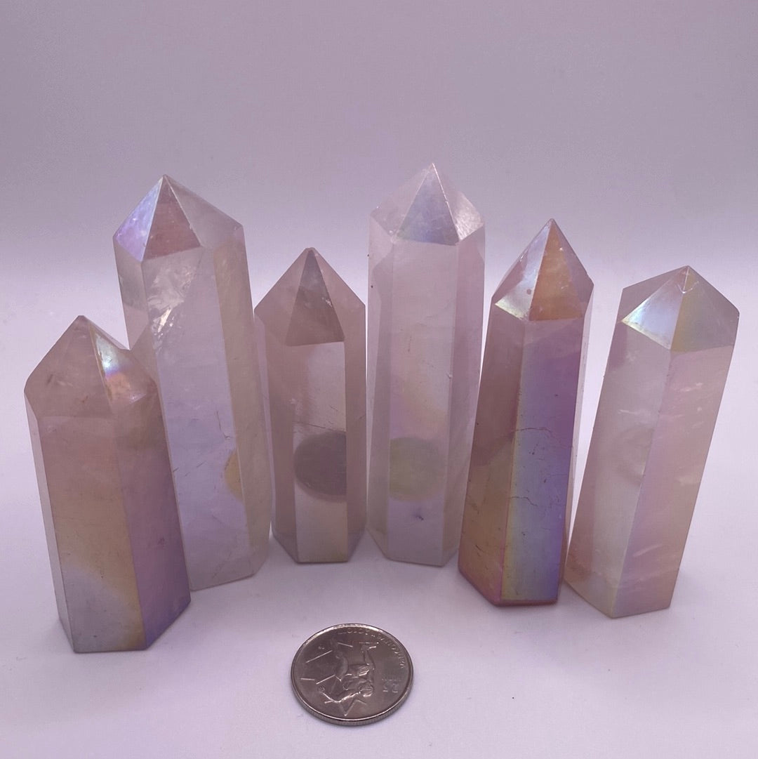 Aura Rose Quartz Polished Points showcasing their beautiful pink color and smooth surfaces, ideal for healing and decoration.