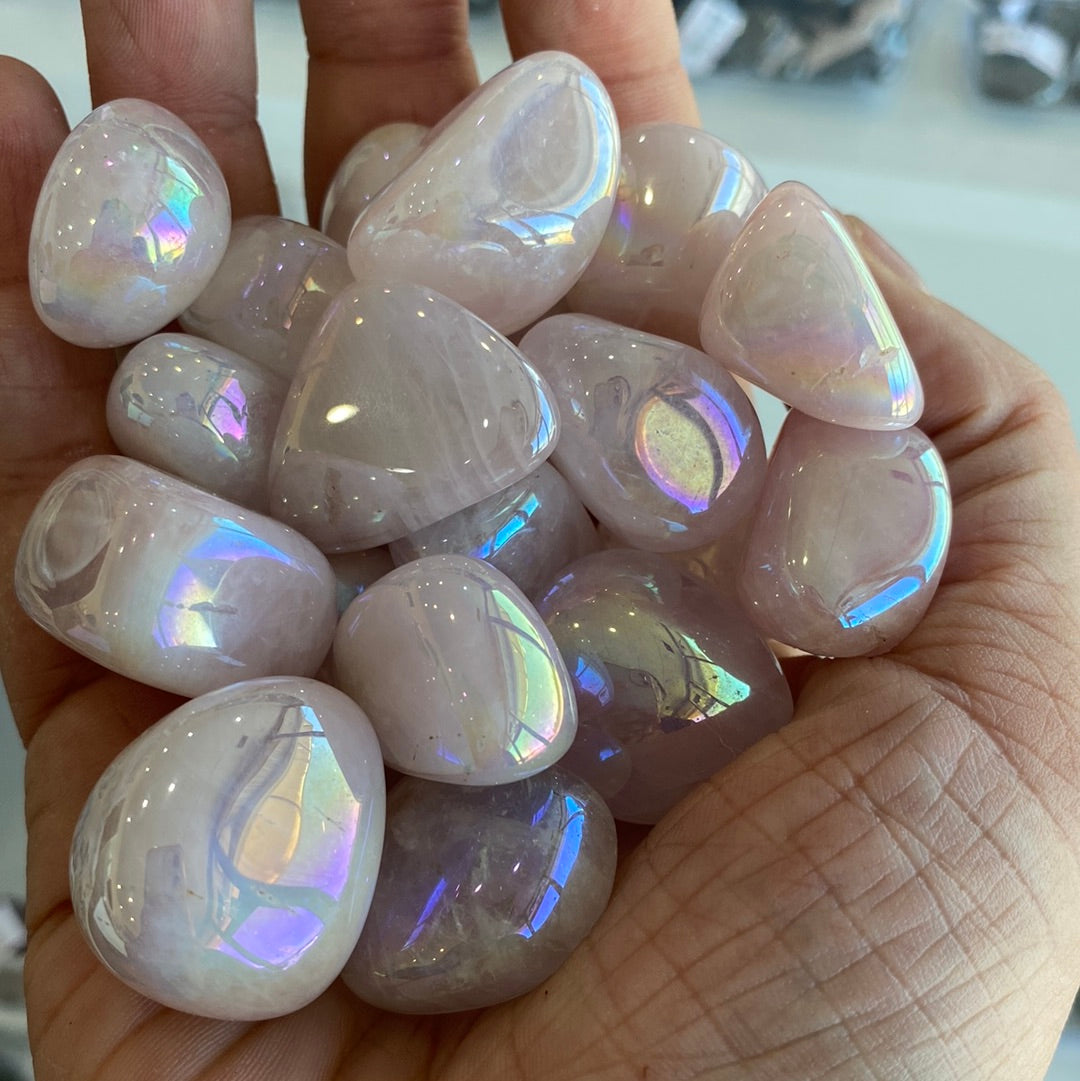 Aura Rose Quartz Tumbled stones showcasing their beautiful pink hue, symbolizing love and healing energy.