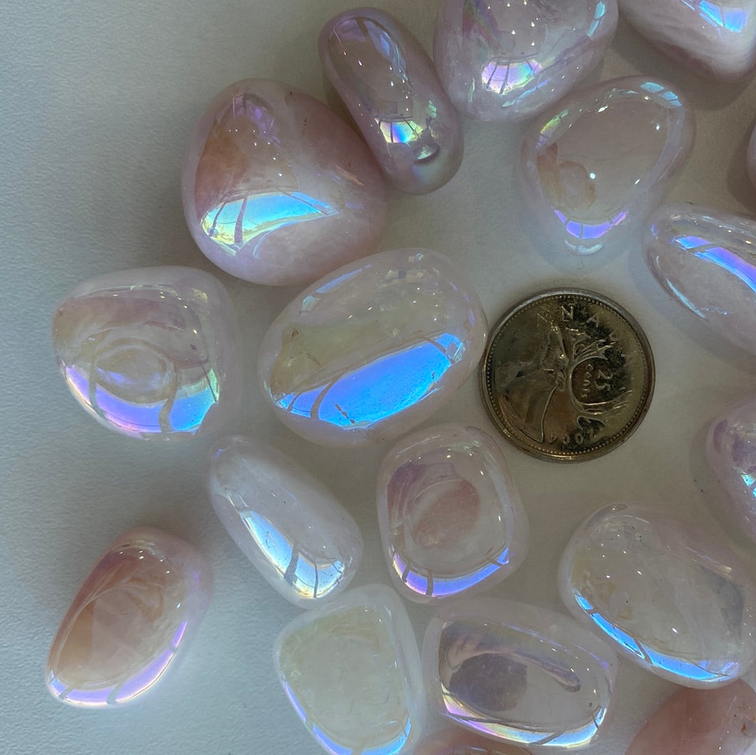 Aura Rose Quartz Tumbled stones showcasing their beautiful pink hue, symbolizing love and healing energy.