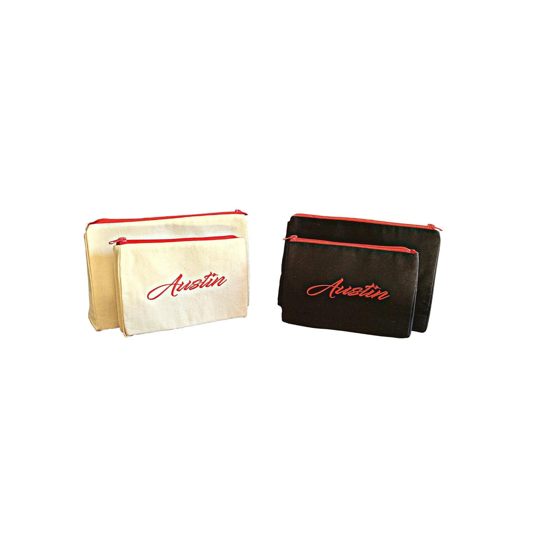 Austin Makeup Bag set featuring embroidered skyline on cream and black cotton canvas with red waterproof lining.