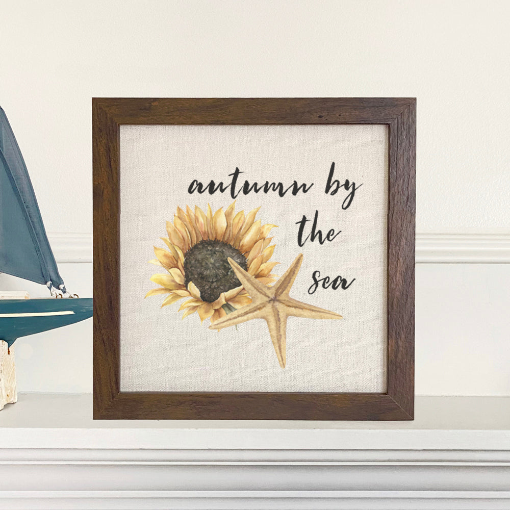 Autumn by the Sea framed sign with a stylized wood frame, featuring eco-friendly printing on a linen-look background.