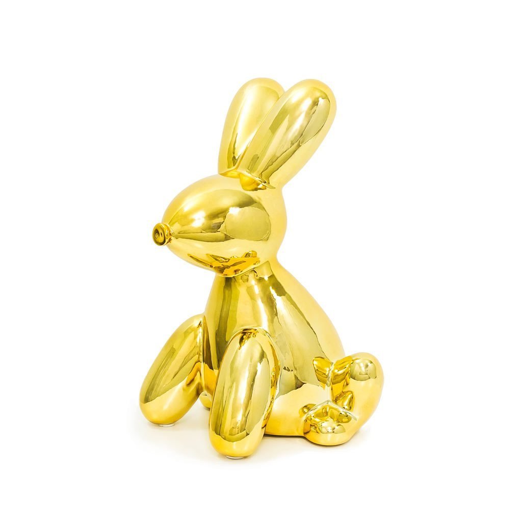 A glossy ceramic balloon bunny money bank in vibrant colors, featuring pink ears and a cheerful smile, perfect for saving coins.