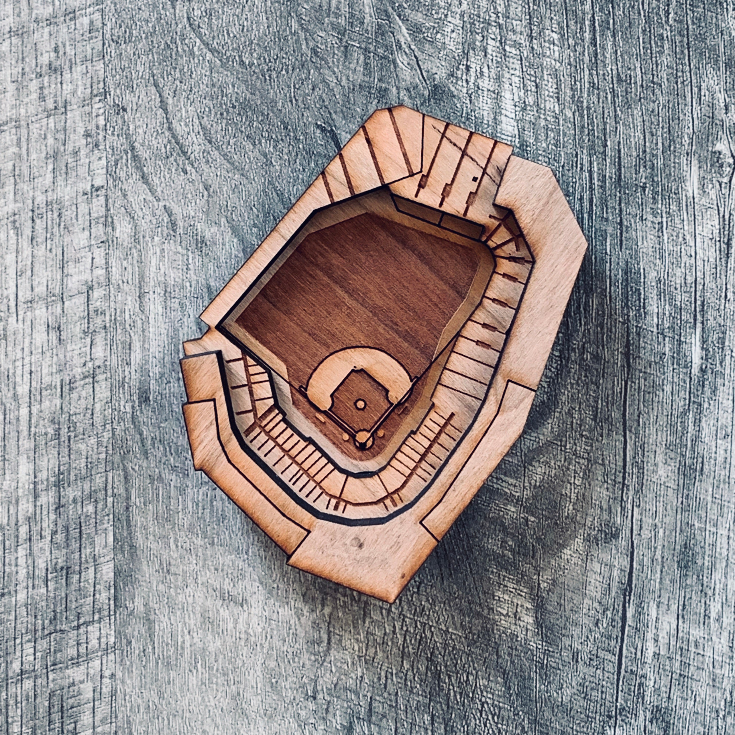 A set of Ballpark Magnets made from cherry hardwood, featuring strong ceramic magnets, displayed in an engraved craft gift box.