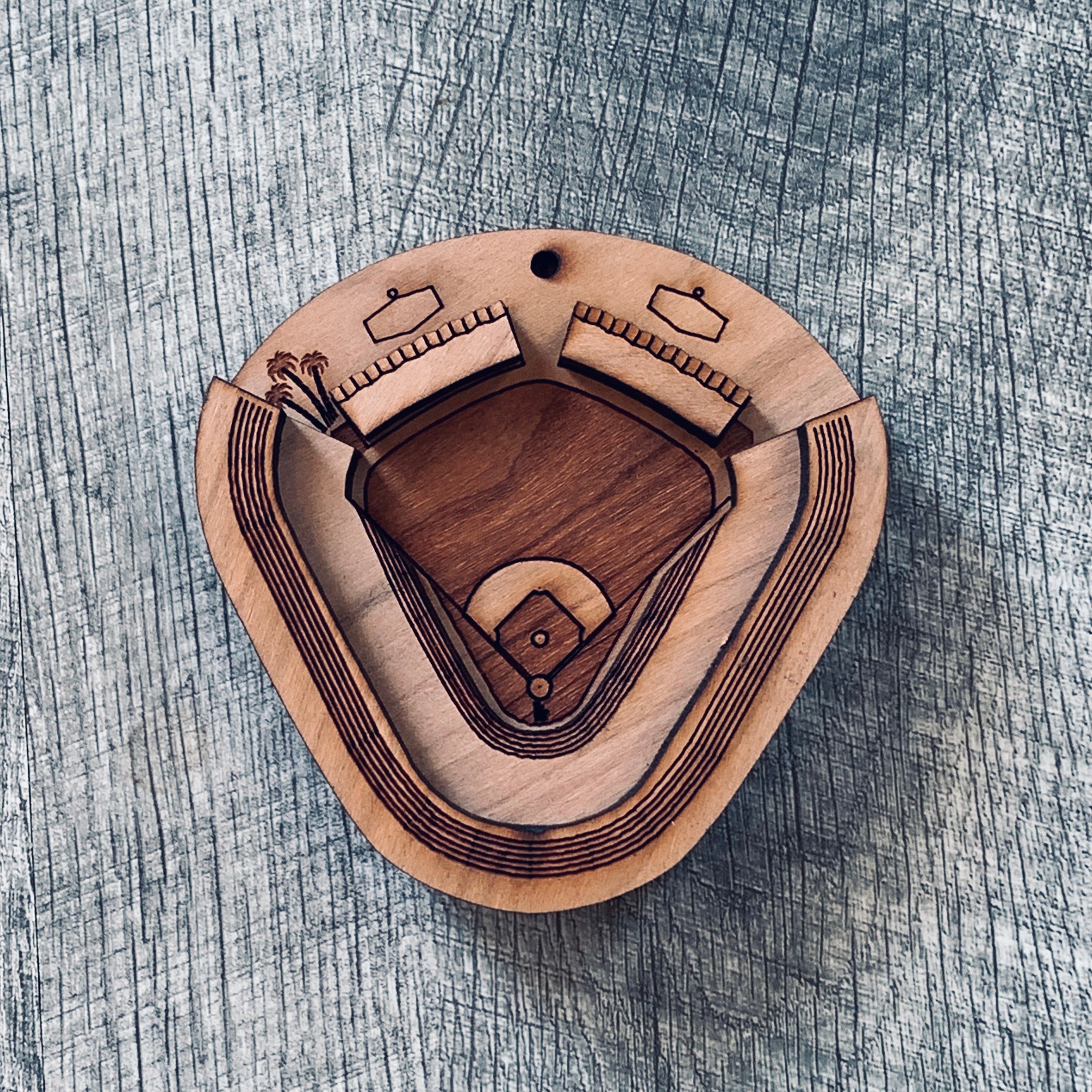 A set of Ballpark Magnets made from cherry hardwood, featuring strong ceramic magnets, displayed in an engraved craft gift box.