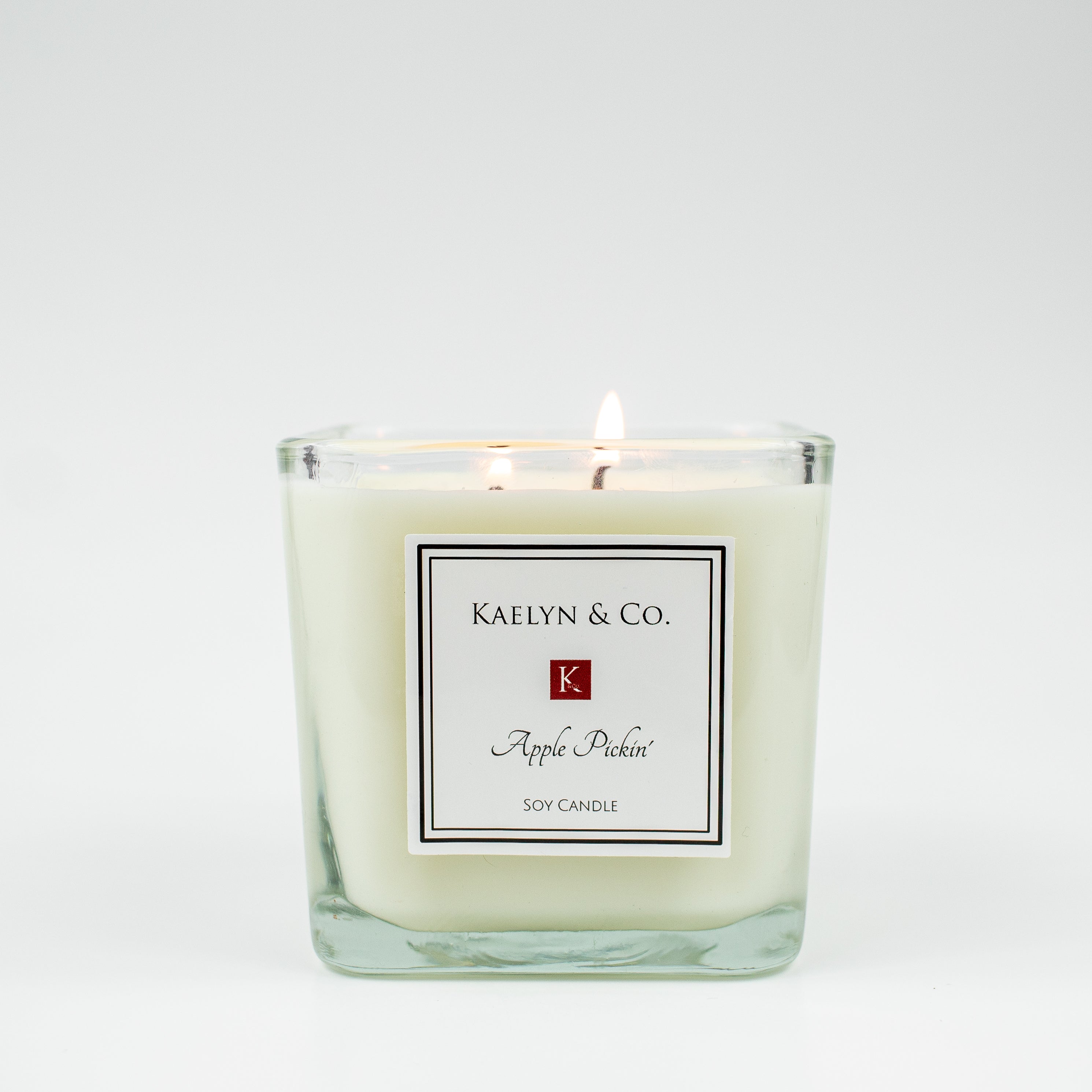 A medium cube candle with a banana bread scent, featuring a warm, inviting design and double wicks for an even burn.