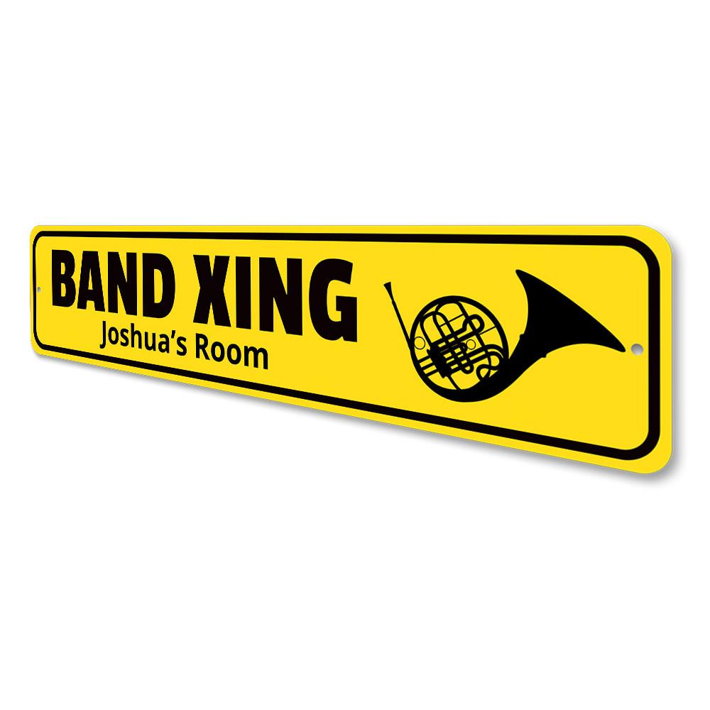 A customizable Band Crossing Sign made of high-quality aluminum, featuring pre-drilled holes for easy mounting, showcasing a unique design.