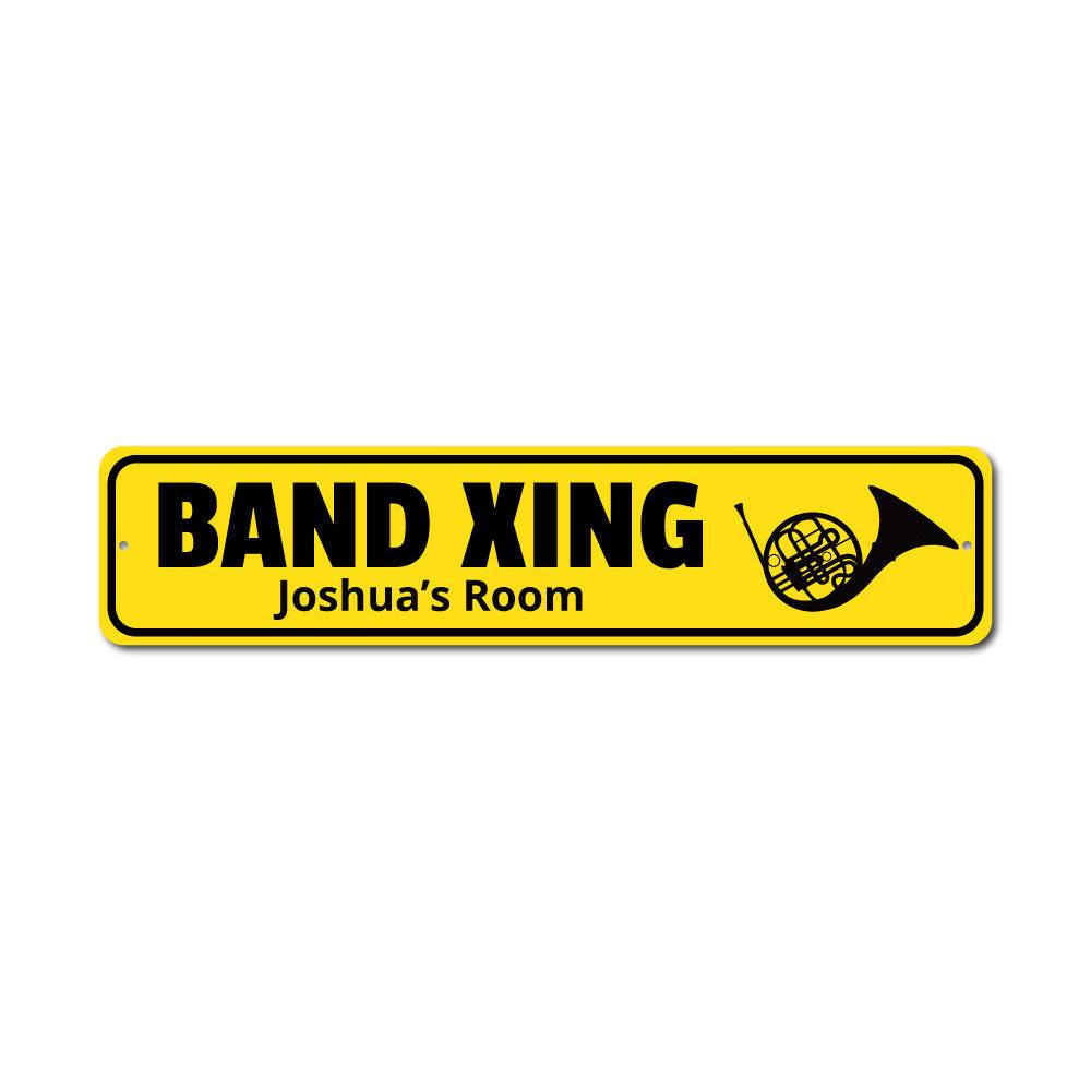 A customizable Band Crossing Sign made of high-quality aluminum, featuring pre-drilled holes for easy mounting, showcasing a unique design.