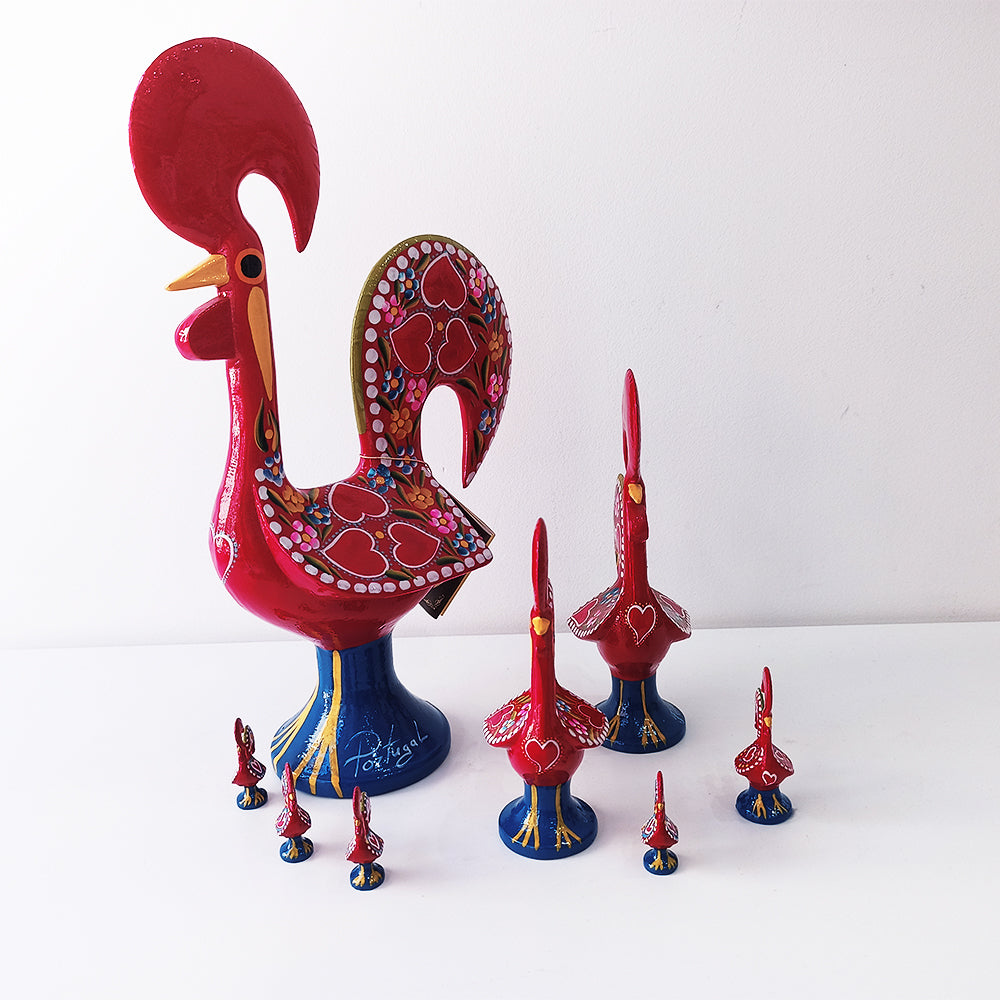 A colorful Barcelos Rooster, handmade from metallic league with intricate hand-painted designs, symbolizing Portuguese culture.