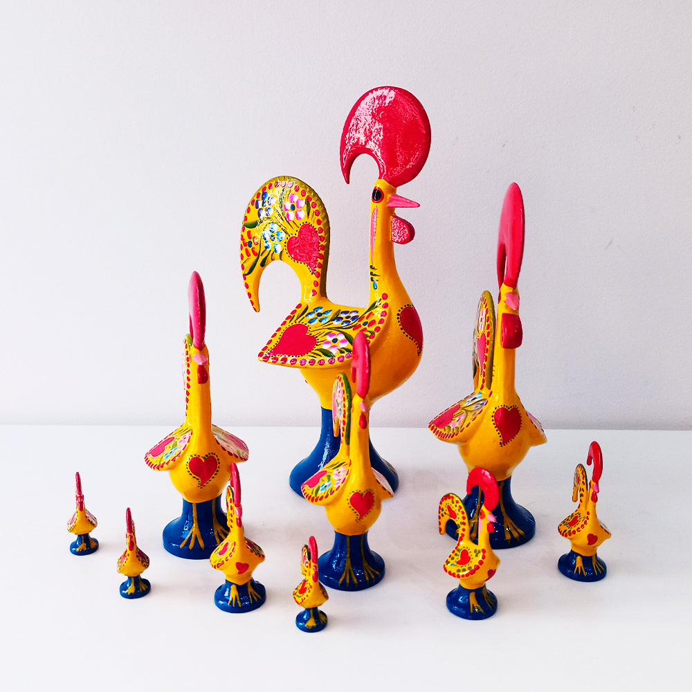 A colorful Barcelos Rooster, handmade from metallic league with intricate hand-painted designs, symbolizing Portuguese culture.