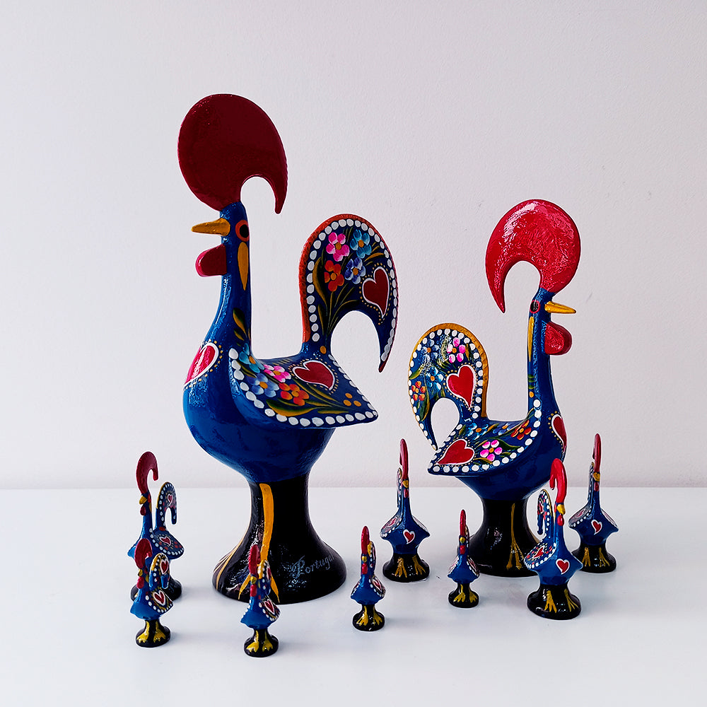 A colorful Barcelos Rooster, handmade from metallic league with intricate hand-painted designs, symbolizing Portuguese culture.