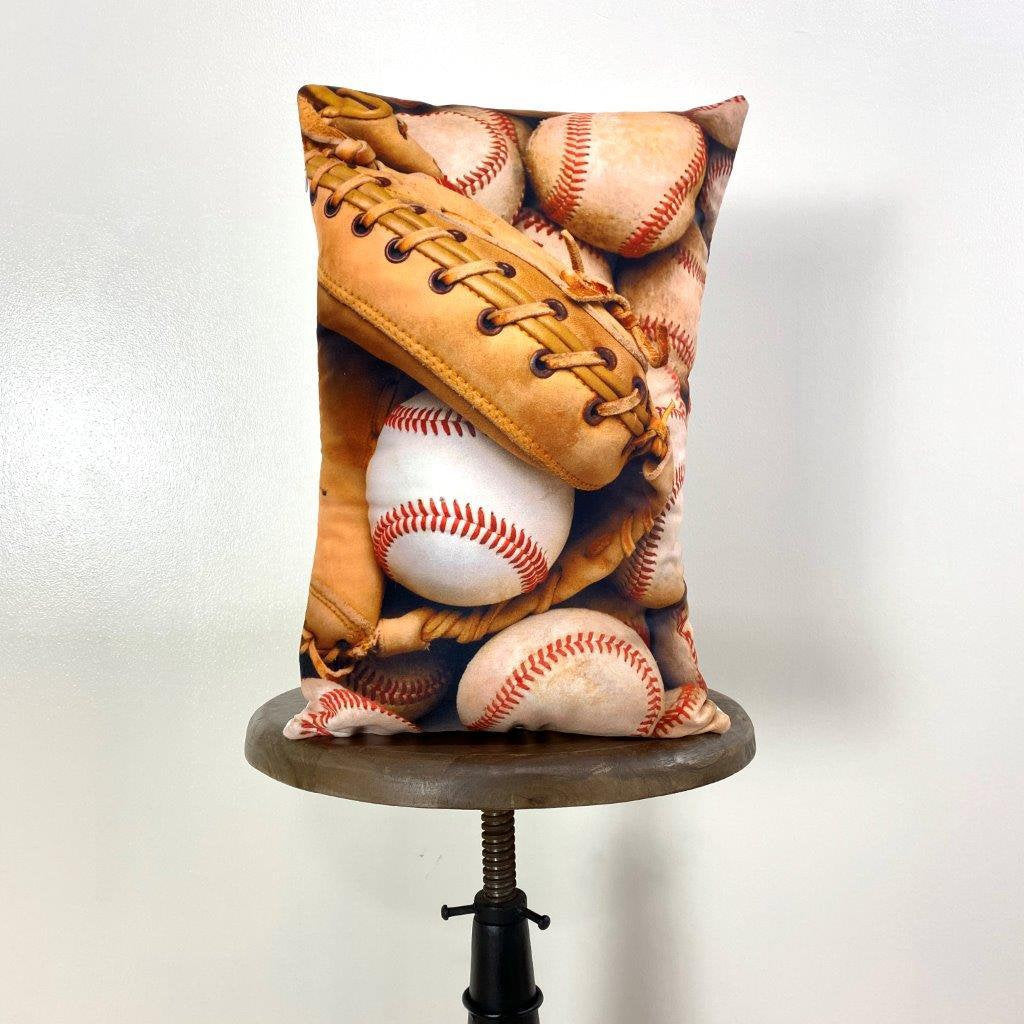 A collection of handcrafted baseball throw pillows featuring glove designs, showcasing crisp graphics and soft fabrics.