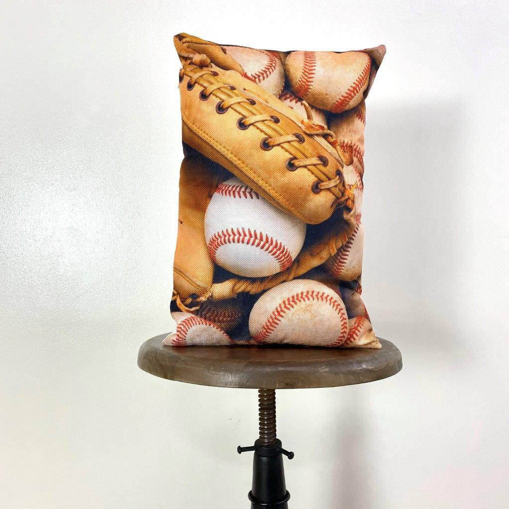 A collection of handcrafted baseball throw pillows featuring glove designs, showcasing crisp graphics and soft fabrics.