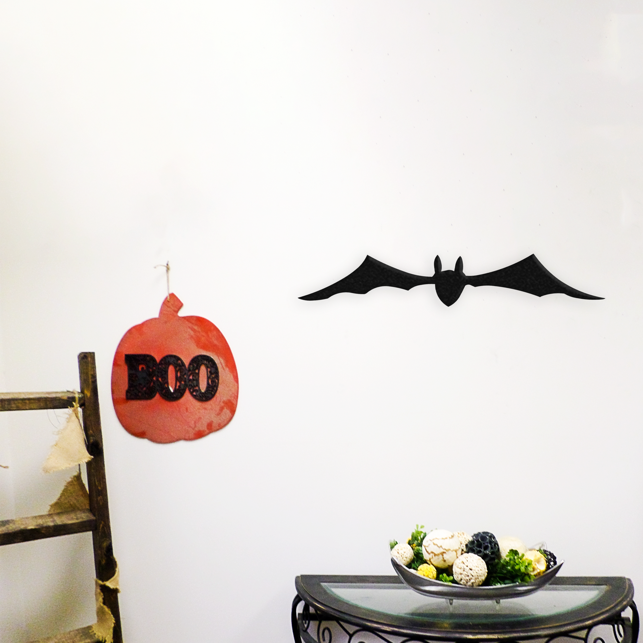 A beautifully crafted bat metal wall art piece, featuring intricate details and a low gloss finish, perfect for Halloween decor.