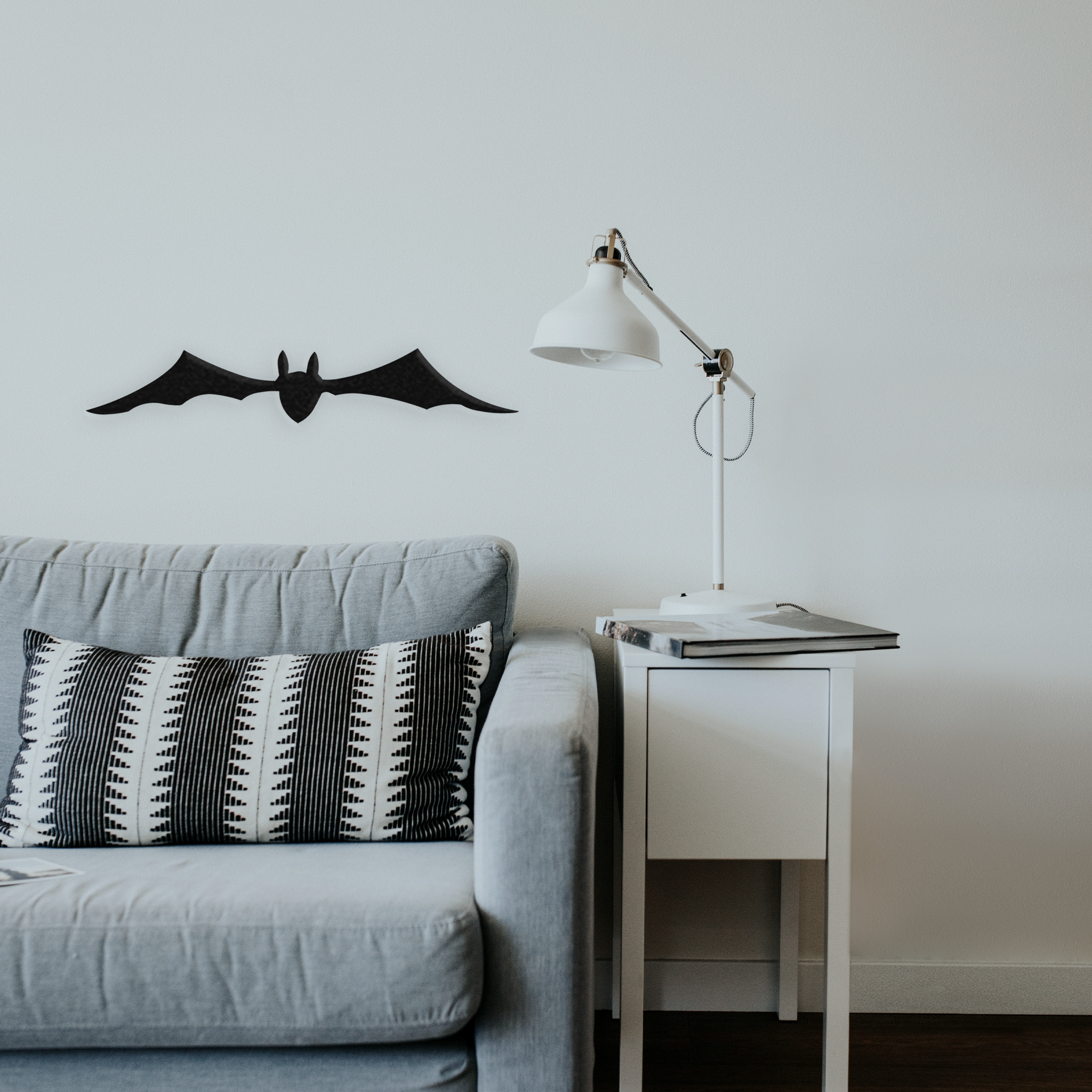 A beautifully crafted bat metal wall art piece, featuring intricate details and a low gloss finish, perfect for Halloween decor.