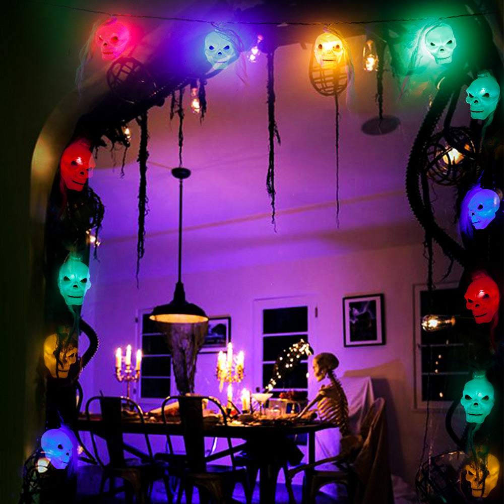 Battery Powered Halloween Ghost Skull Lights featuring 12 LED skulls on a 6-foot string, perfect for spooky decorations.