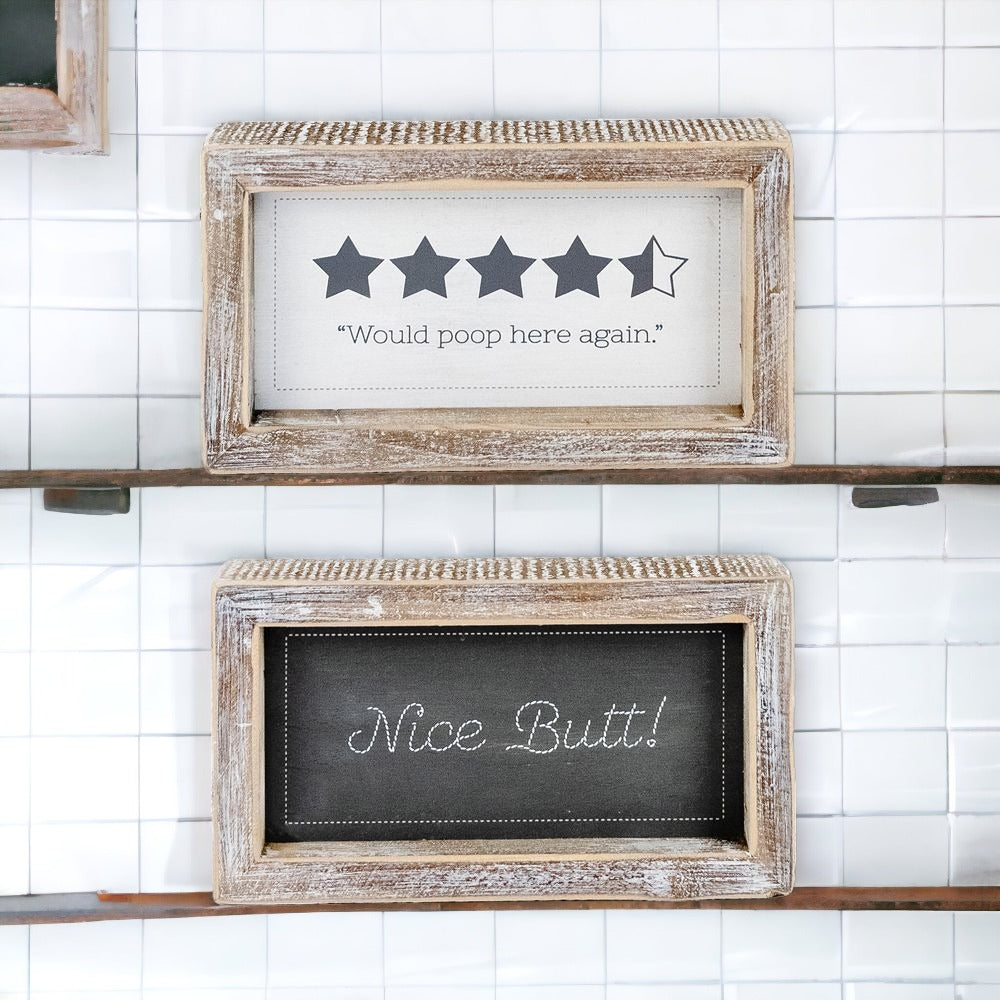 Double-sided bathroom sign featuring humorous quotes, framed in a thick wooden frame, suitable for freestanding or wall display.