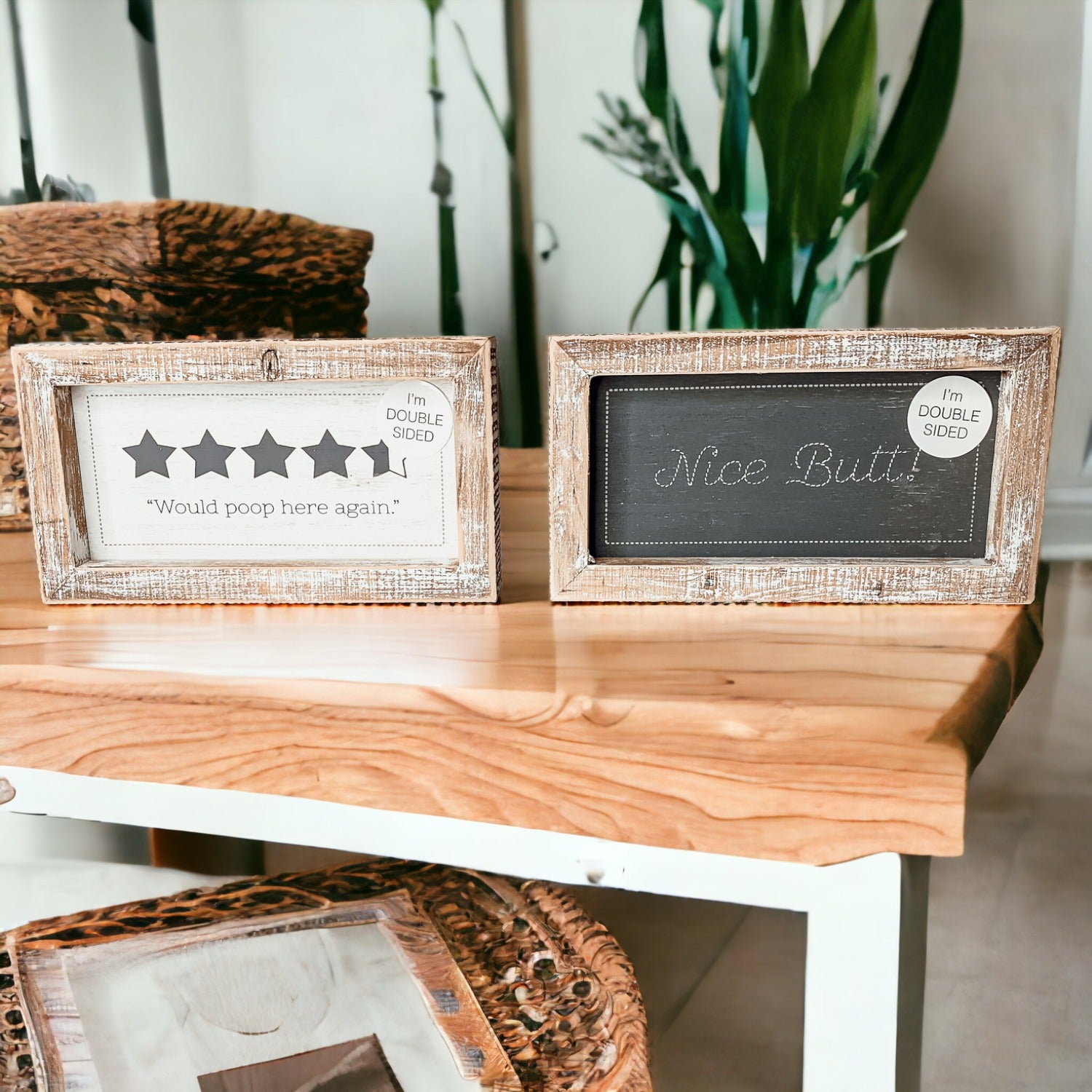 Double-sided bathroom sign featuring humorous quotes, framed in a thick wooden frame, suitable for freestanding or wall display.