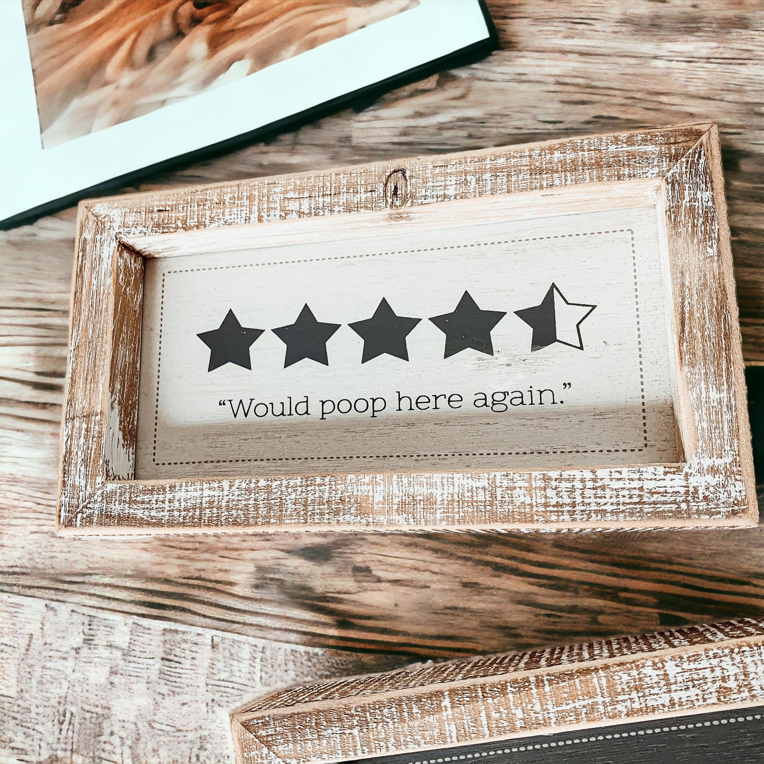 Double-sided bathroom sign featuring humorous quotes, framed in a thick wooden frame, suitable for freestanding or wall display.