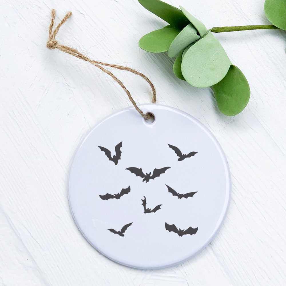 A beautifully crafted porcelain ornament featuring a bat design, showcasing vibrant colors and a glossy finish.