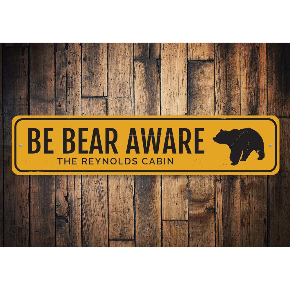 Be Bear Aware Sign made of durable aluminum, featuring a unique design perfect for lakehouse decor.