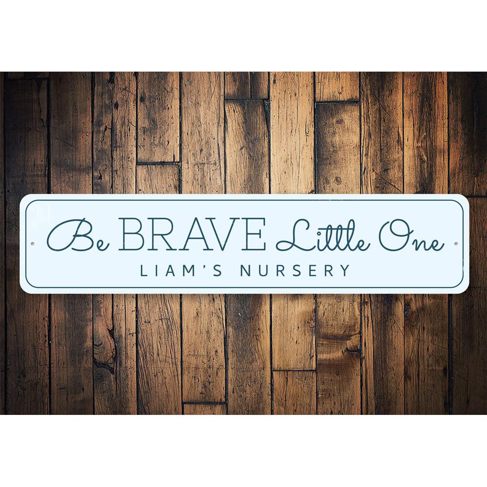 Be Brave Little One Sign, a decorative aluminum wall sign for children's rooms, featuring a whimsical design that inspires courage.