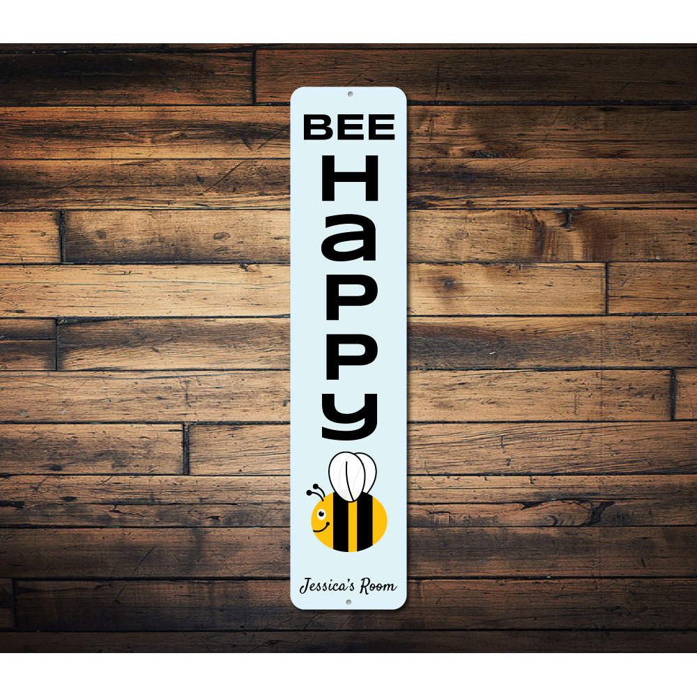 A colorful Bee Happy Sign made of aluminum, featuring cheerful bee graphics and customizable text, perfect for children's rooms.