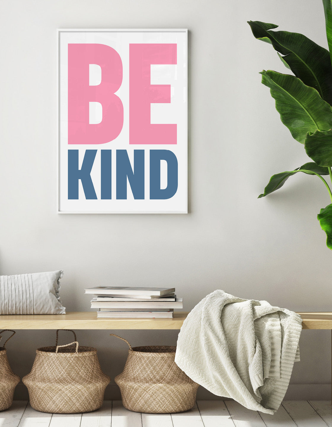 A colorful typographic print featuring the words 'Be Kind' in bold letters, perfect for home or office decor.