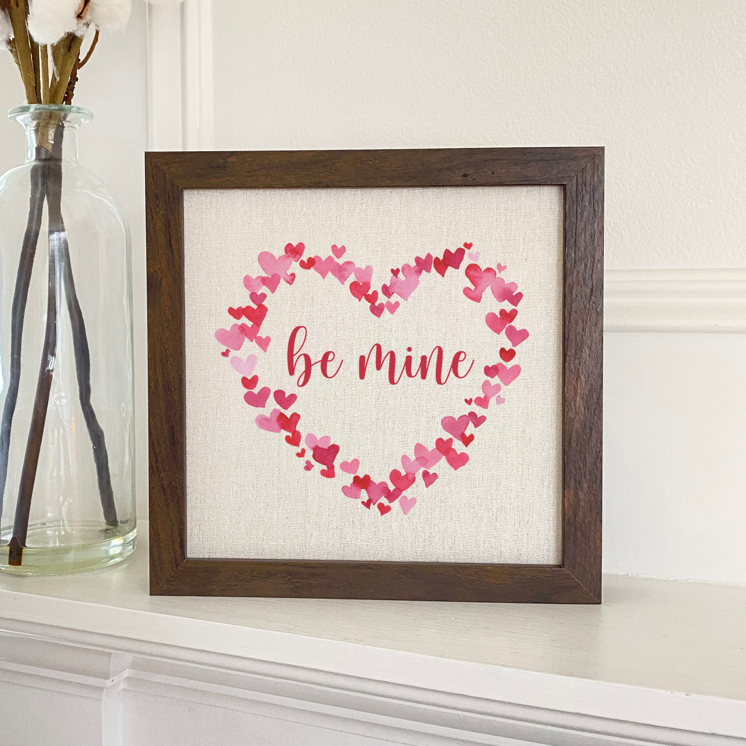 Be Mine Framed Sign with a stylish wood frame and linen-look background, perfect for home decor.