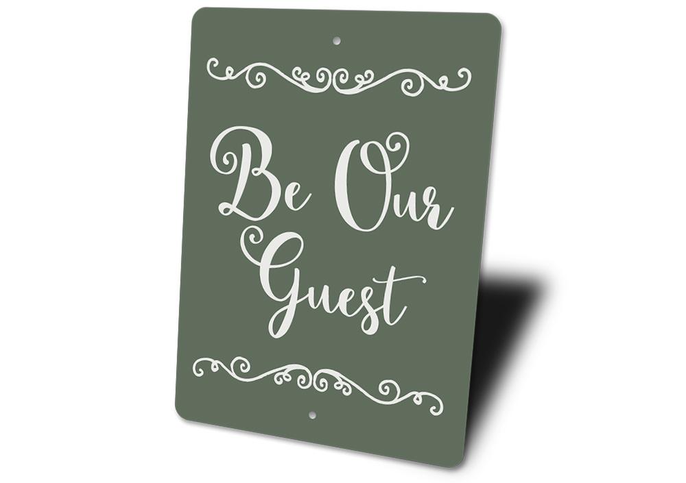 A decorative Be Our Guest Sign made of high-quality aluminum, featuring a welcoming design suitable for indoor and outdoor use.