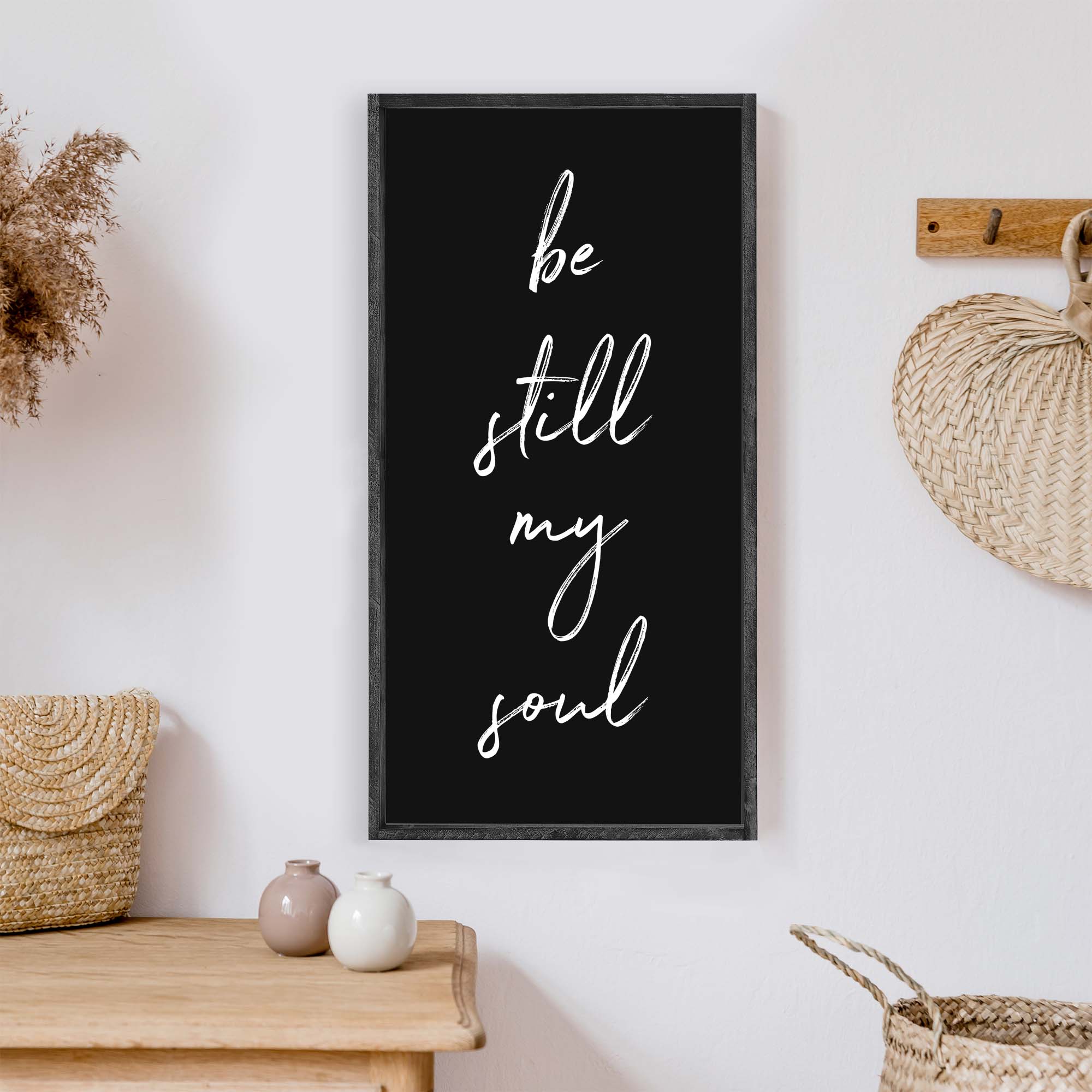 Be Still My Soul Wood Sign featuring white text on a painted wall-like background, framed in stained pine wood, handmade in Toronto.