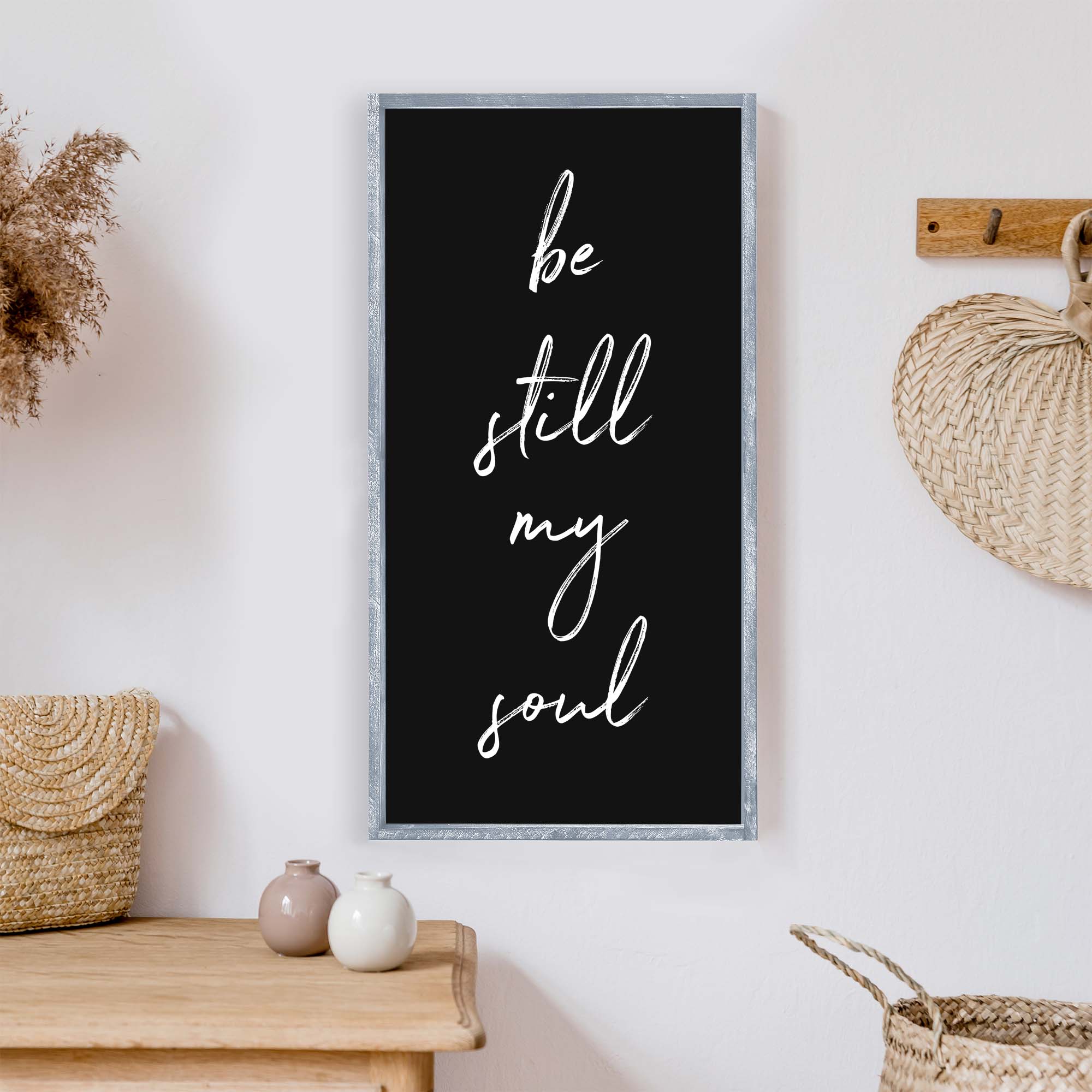 Be Still My Soul Wood Sign featuring white text on a painted wall-like background, framed in stained pine wood, handmade in Toronto.