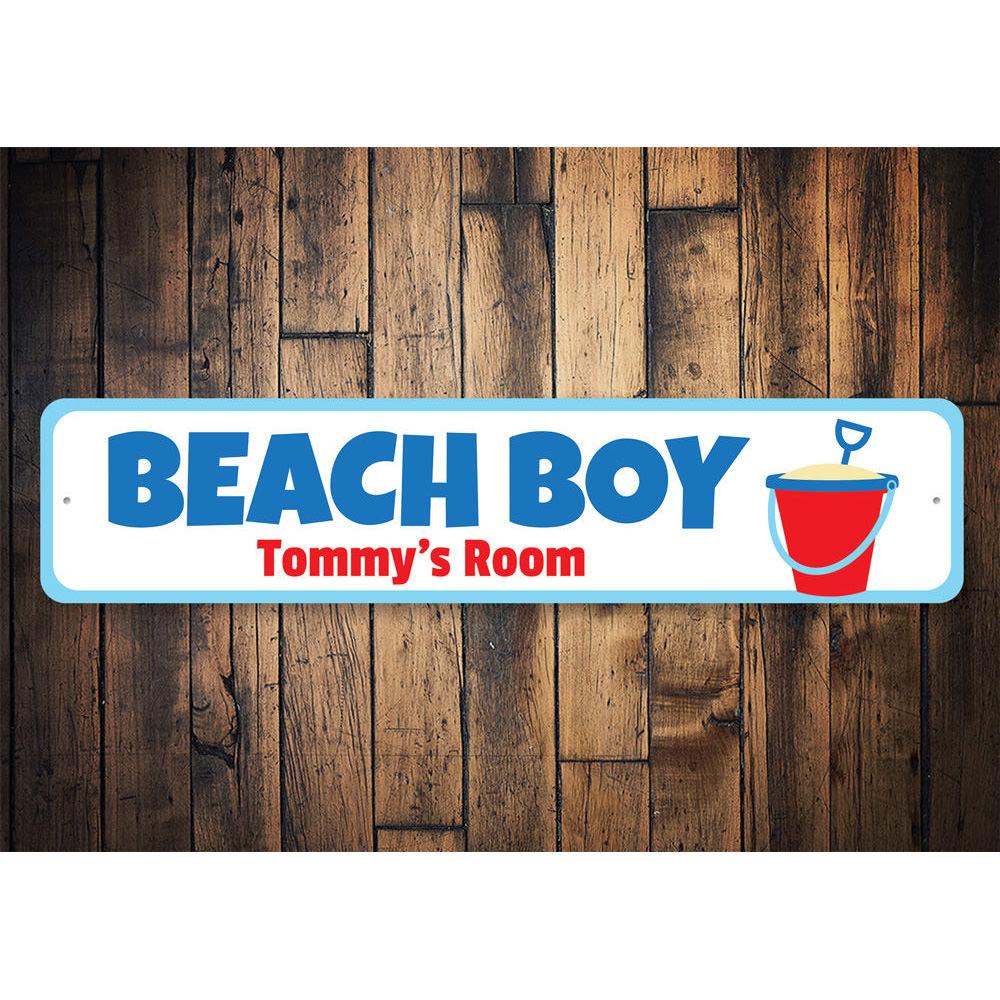 A colorful Beach Boy Sign made of aluminum, featuring beach-themed graphics and customizable text, perfect for kids' rooms.