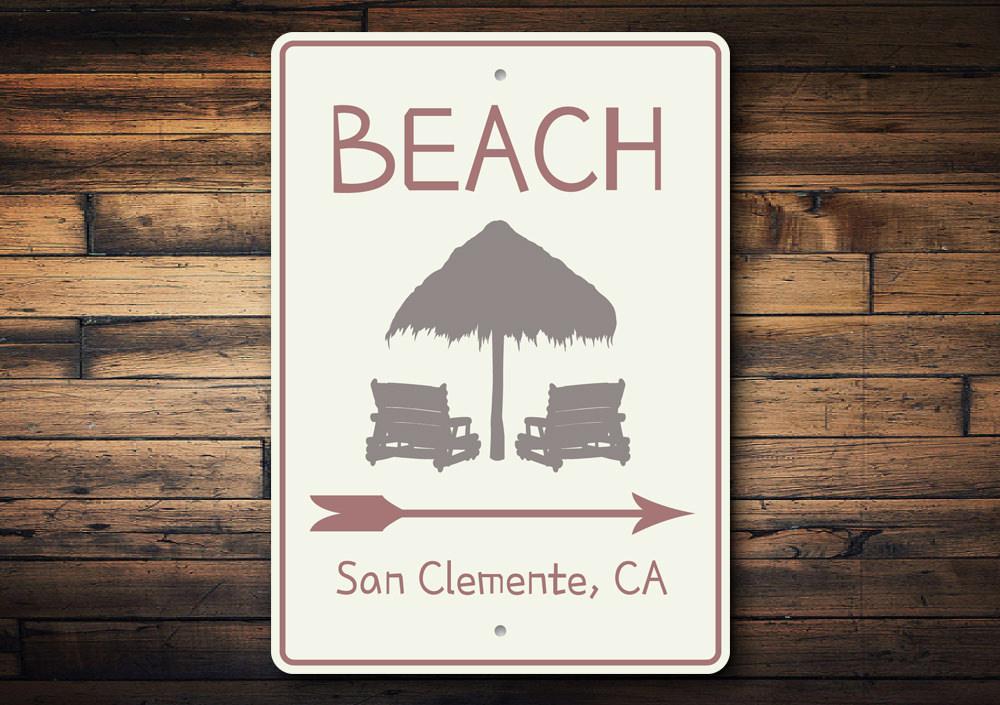 Beach Directional Arrow Sign made of aluminum, featuring customizable text and pre-drilled holes for easy mounting.