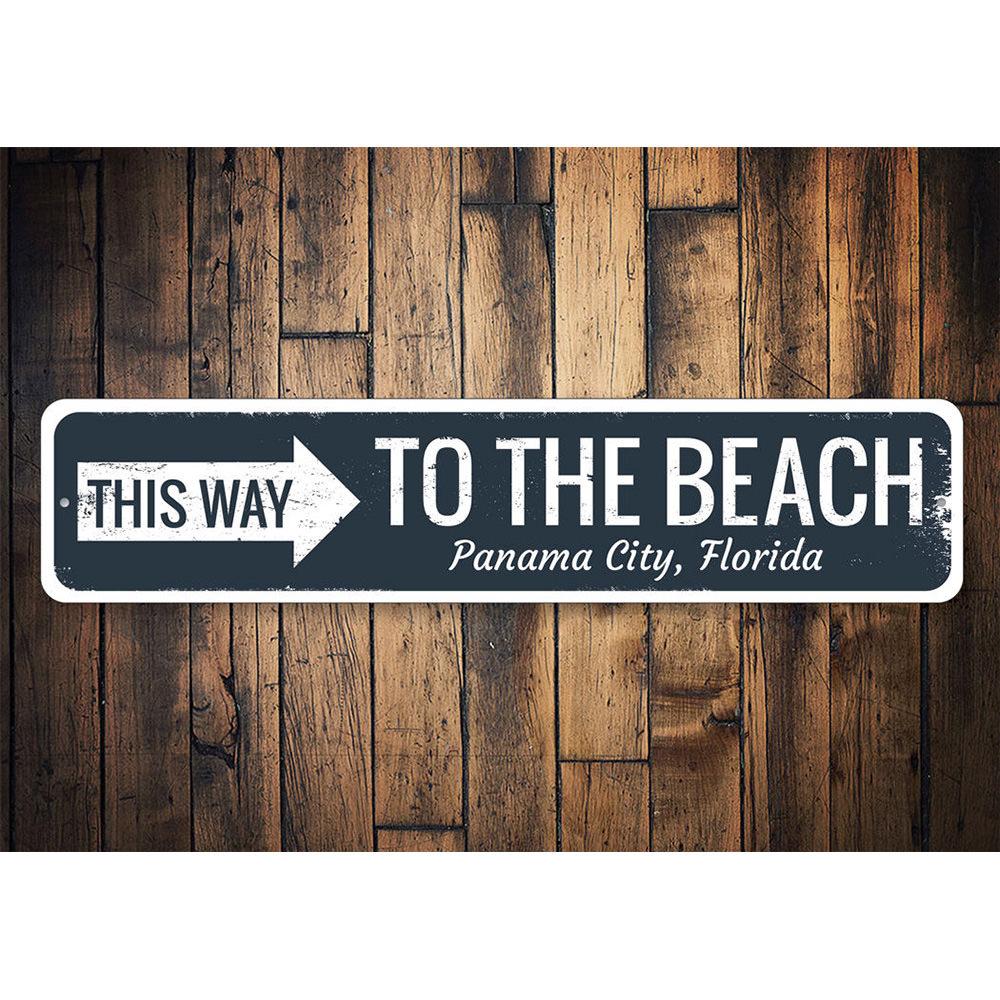 A beautifully crafted Beach Directional Sign made of aluminum, featuring customizable text and a coastal design, perfect for beach houses and decor.