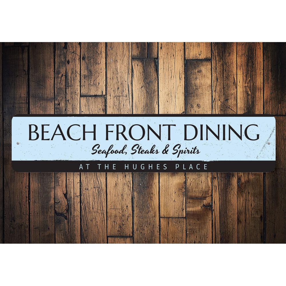 A decorative Beach Front Dining Sign made of high-quality aluminum, featuring a coastal design perfect for beach houses and seafood restaurants.