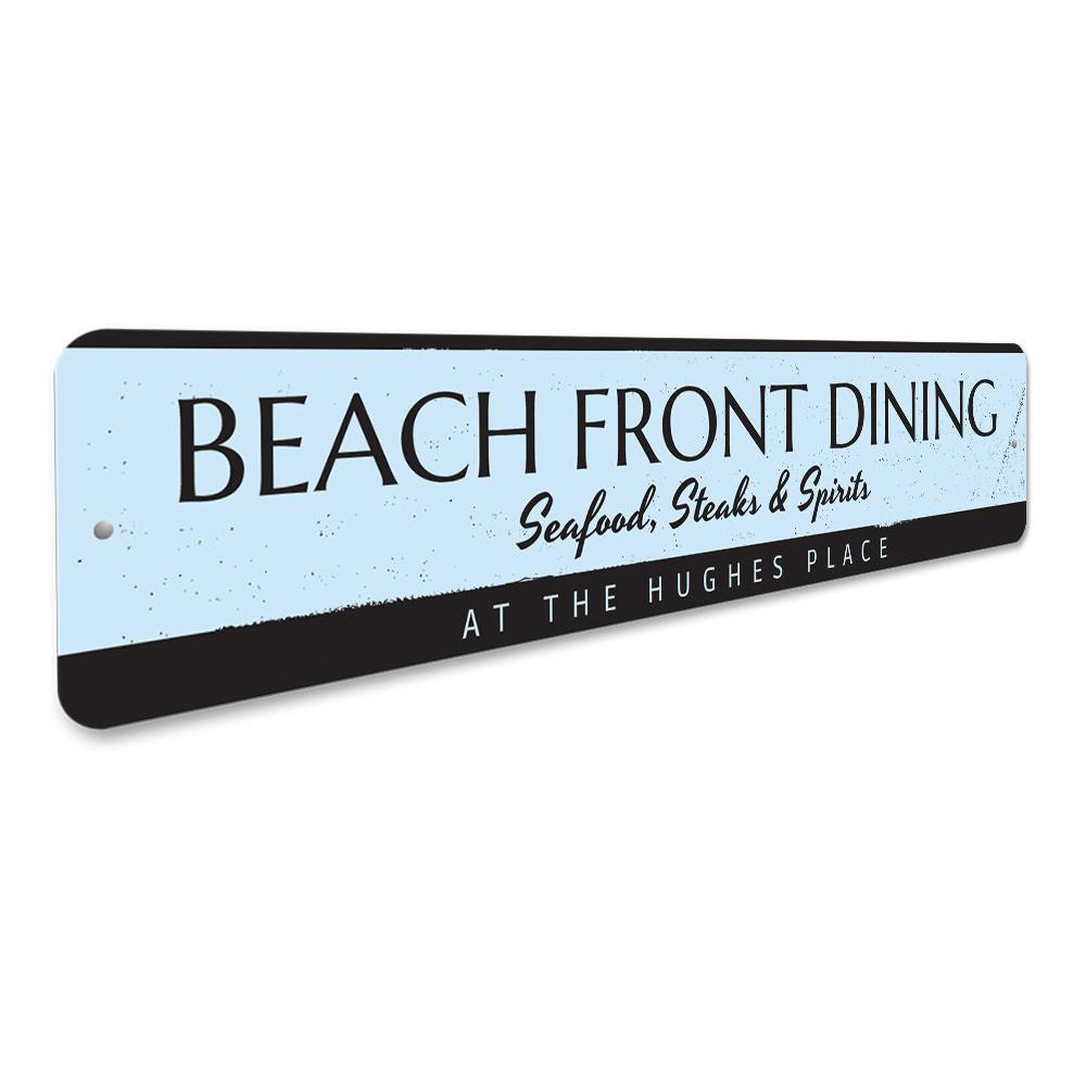 A decorative Beach Front Dining Sign made of high-quality aluminum, featuring a coastal design perfect for beach houses and seafood restaurants.