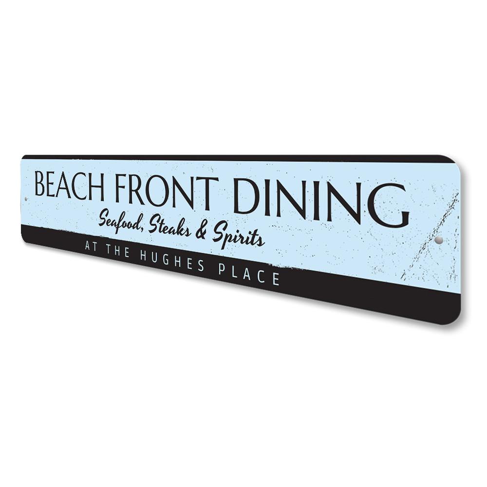 A decorative Beach Front Dining Sign made of high-quality aluminum, featuring a coastal design perfect for beach houses and seafood restaurants.