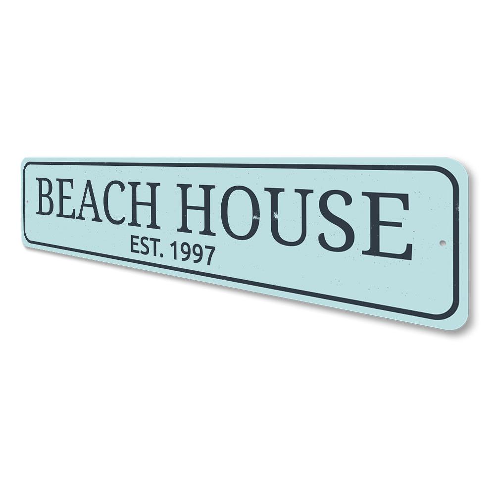 A personalized Beach House Established Date Sign made of high-quality aluminum, featuring custom text and a coastal design, suitable for indoor and outdoor use.