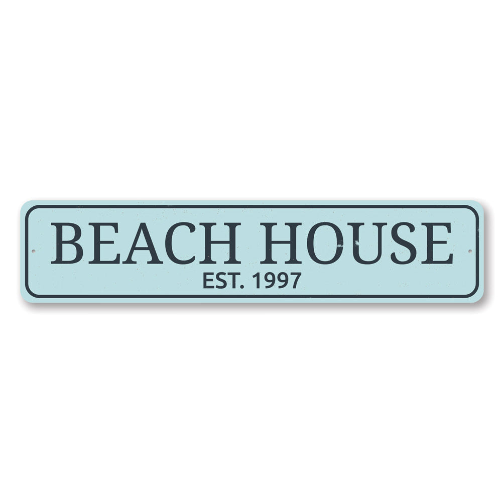 A personalized Beach House Established Date Sign made of high-quality aluminum, featuring custom text and a coastal design, suitable for indoor and outdoor use.