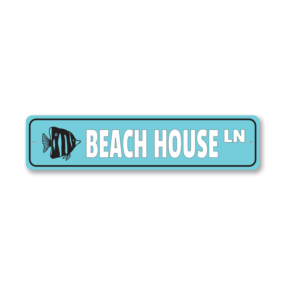 A stylish Beach House Street Sign made of high-quality aluminum, featuring customizable text and pre-drilled holes for easy mounting.