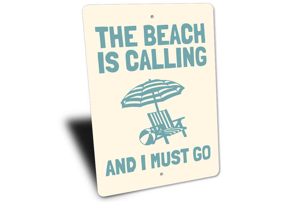 A decorative metal sign reading 'Beach is Calling and I Must Go', featuring a coastal design, perfect for beach houses and outdoor spaces.