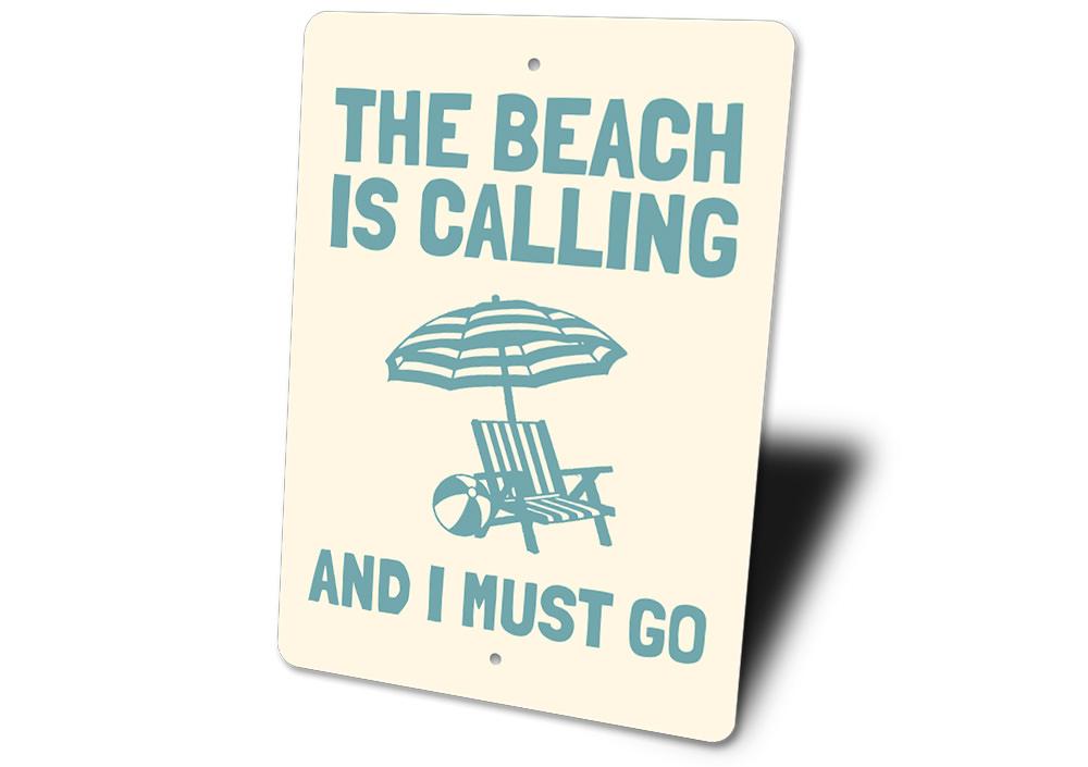 A decorative metal sign reading 'Beach is Calling and I Must Go', featuring a coastal design, perfect for beach houses and outdoor spaces.