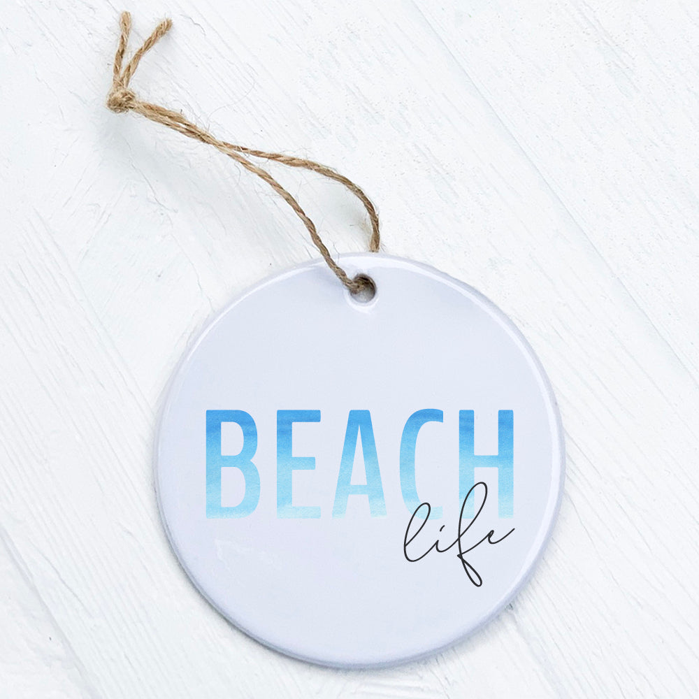 A beautifully crafted Beach Life Ornament made of high-quality porcelain, featuring vibrant beach-themed designs and a glossy finish.