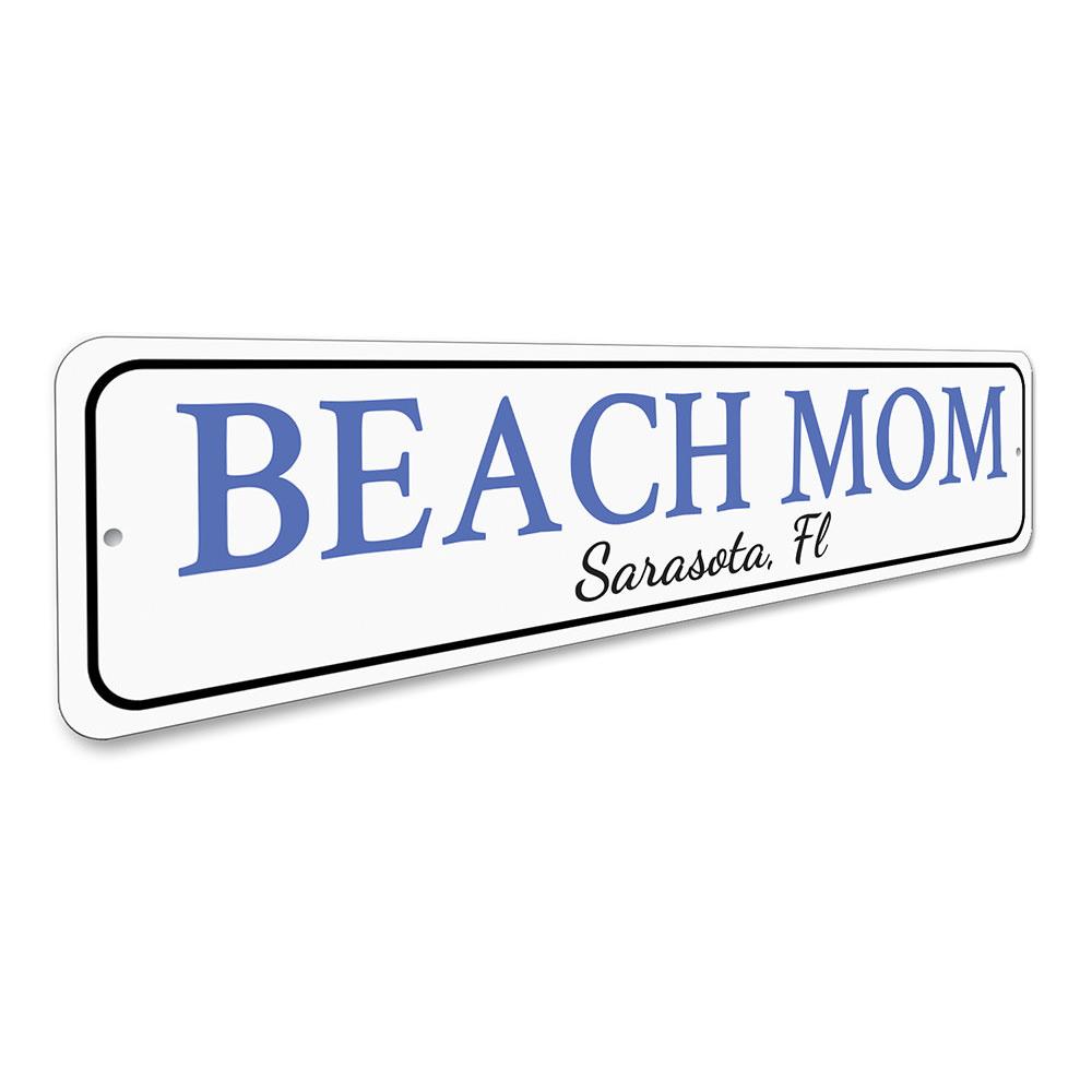 A decorative Beach Mom Sign made of high-quality aluminum, featuring customizable text and pre-drilled holes for easy mounting.