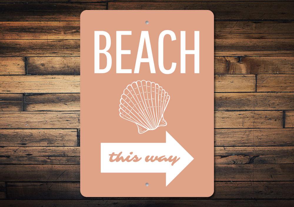 A decorative Beach Shell Sign made of high-quality aluminum, featuring a beautiful beach-themed design, perfect for coastal decor.