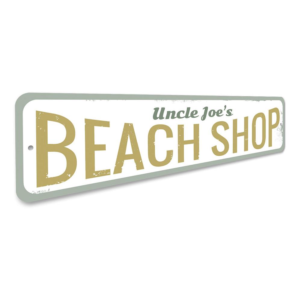 A vibrant Beach Shop Sign made of aluminum, featuring customizable text, perfect for coastal decor.