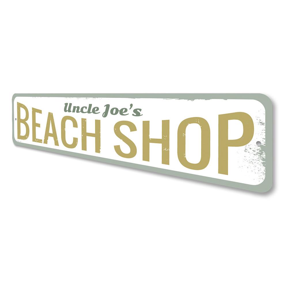 A vibrant Beach Shop Sign made of aluminum, featuring customizable text, perfect for coastal decor.